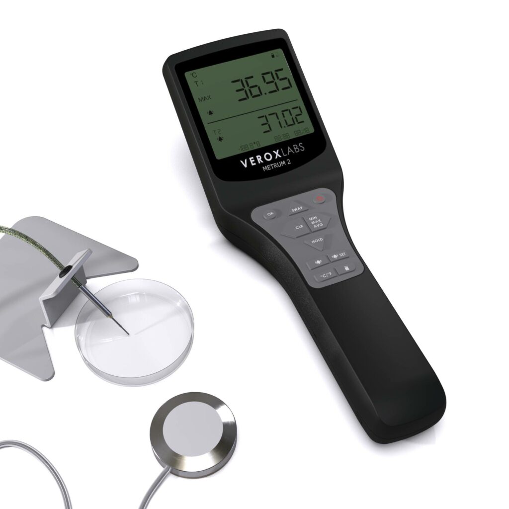 Digital thermometer for IVF Quality control procedures with 2 sensor probes. A thermocouple needle probe on a probe holder aiming at a petri dish and a disk probe with a wire
