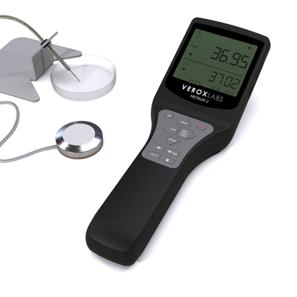 Digital thermometer for IVF QC procedures with 2 sensor probes. A thermocouple needle probe on a probe holder aiming at a petri dish and a disk probe with a wire
